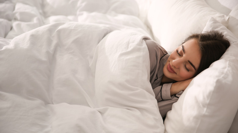 Woman comfy sleeping with blanket