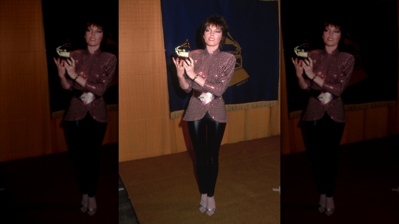 Pat Benatar holding her Grammy at the awards show in early 1980s