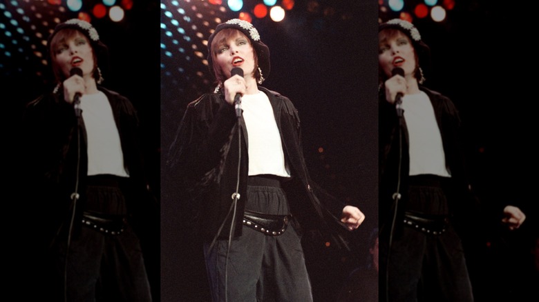 Pat Benatar wearing black and white outfit on stage