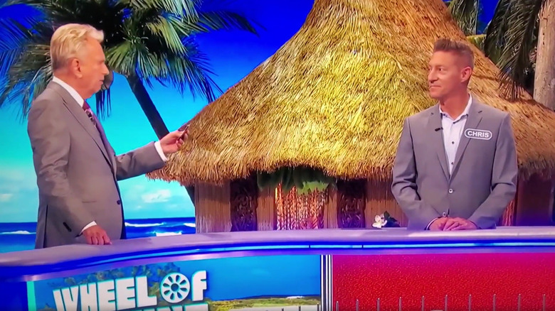 Pat Sajak talking to contestant