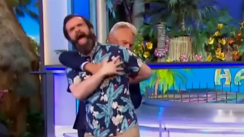 Pat Sajak wrestles contestant