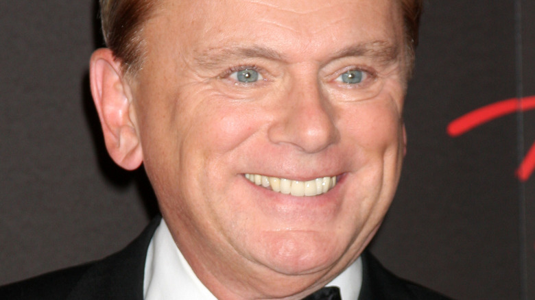 Pat Sajak smiling and wearing a tux