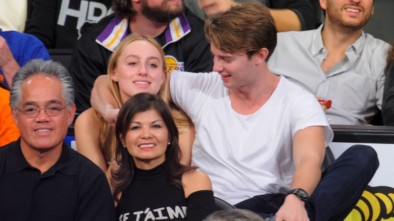 Taylor Burns and Patrick Schwarzenegger at a Lakers game in January 2014