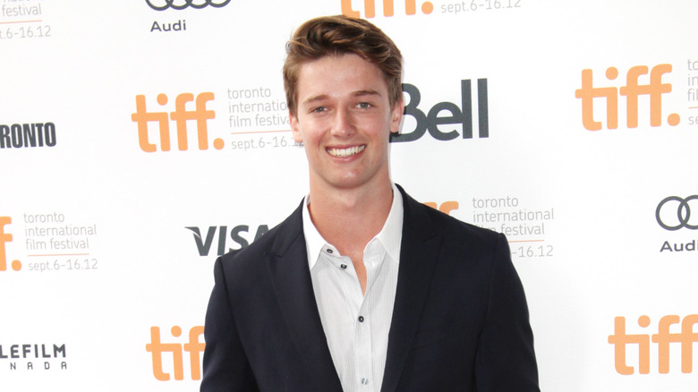 Patrick Schwarzenegger smiling at an event in 2012