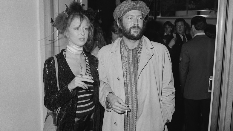 Pattie Boyd and Eric Clapton posing together.