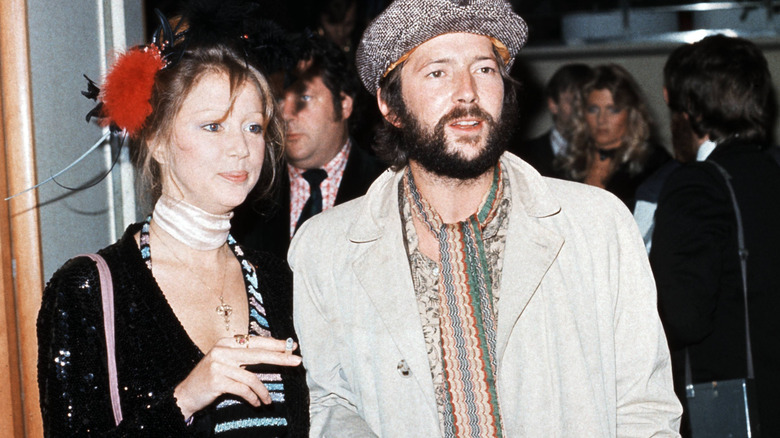 Pattie Boyd and Eric Clapton standing together and posing.