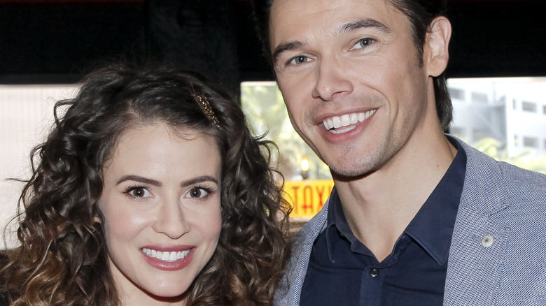 Linsey Godfrey posing with Paul Telfer