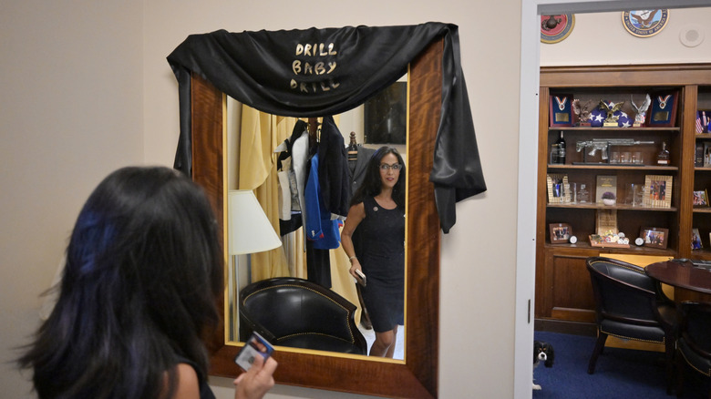 Lauren Boebert looks in the mirror in her office