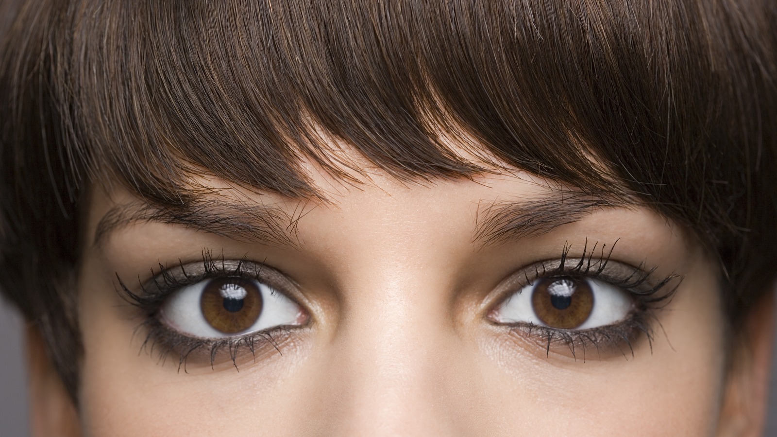 People Are Using Eyelash Glue To Keep Their Bangs In Place. Is It Safe