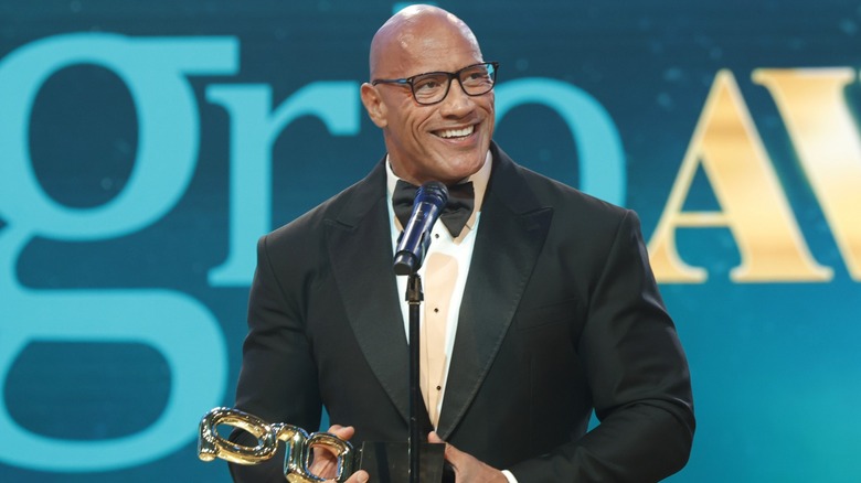 Dwayne Johnson smiling in glasses