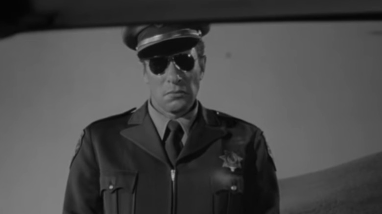 Mort Mills as the police officer in Alfred Hitchcock's "Psycho"