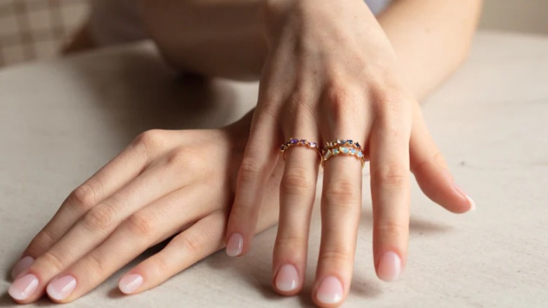 birthstone rings on fingers