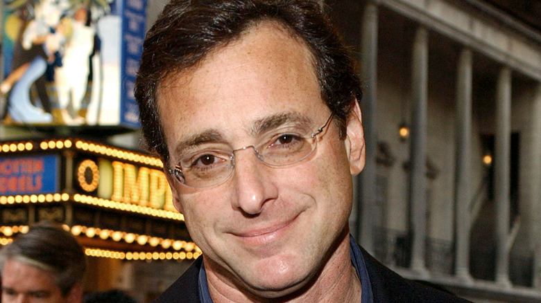 Bob Saget smiles at an event