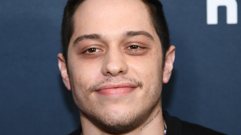 Pete Davidson smiles on the red carpet