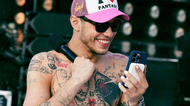 Pete Davidson shirtless with phone