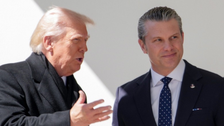 Donald Trump speaks to Pete Hegseth at the White House