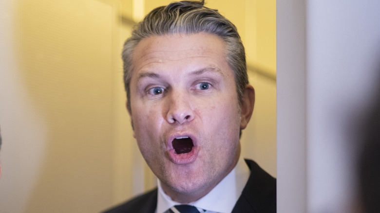 : U.S. Secretary of War Pete Hegseth answers a question as he, U.S. President Donald Trump and United States Special Envoy to the Middle East Steve Witkoff speak to members of the media traveling on Air Force One as President Trump heads to Miami on March 7, 2026.