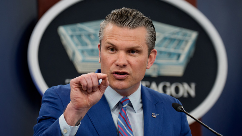 Closeup of Pete Hegseth pointing and speaking at podium during Pentagon briefing