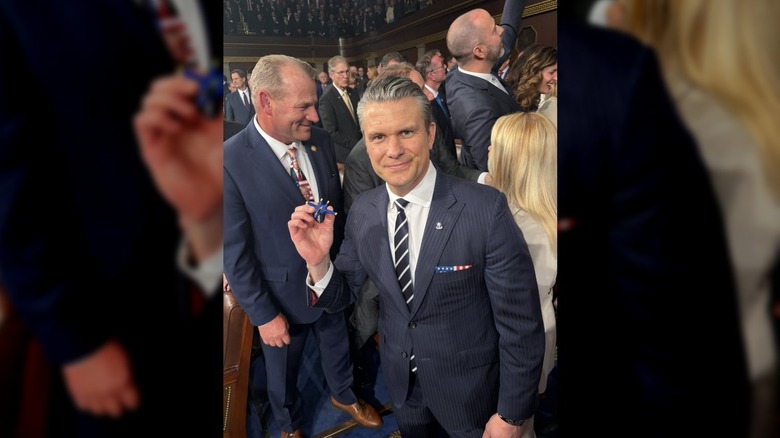 U.S. Secretary of defense Pete Hegseth holds a toy plane at the State of the Union.