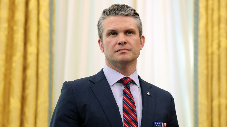 U.S. Secretary of Defense Peter Hegseth listens as U.S. President Donald Trump delivers remarks in the Oval Office of the White House on March 21, 2025 in Washington, DC.