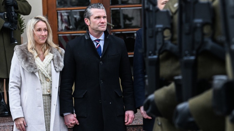 Jennifer Cunningham Hegseth and Pete Hegseth watch a military parade in Warsaw, Poland (2025)