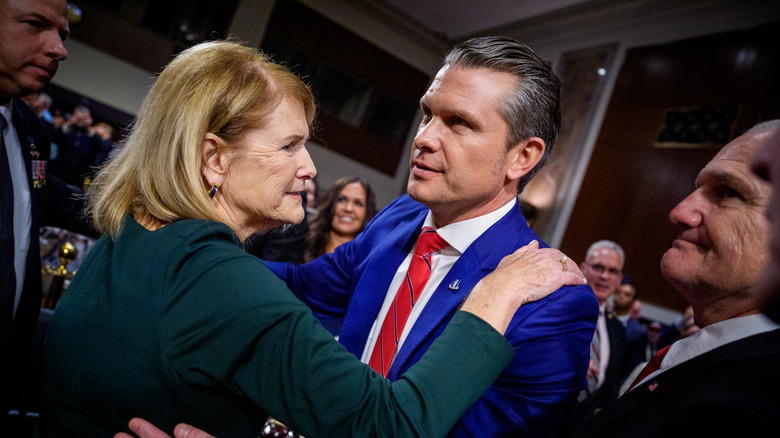 Penelope and Pete Hegseth mid-hug at his swearing-in ceremony