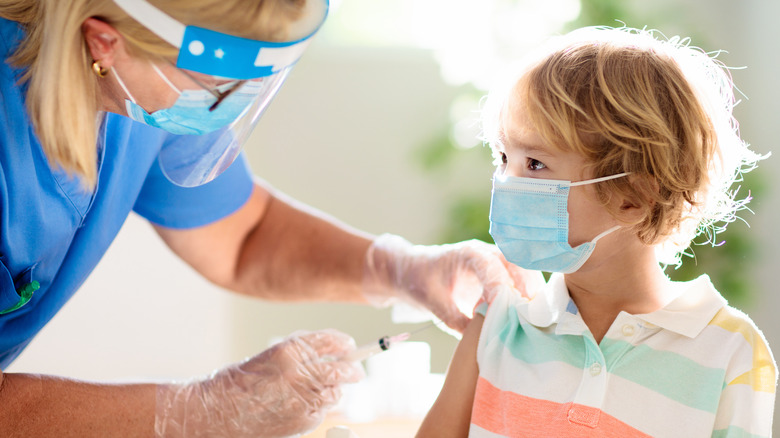 young child getting vaccine