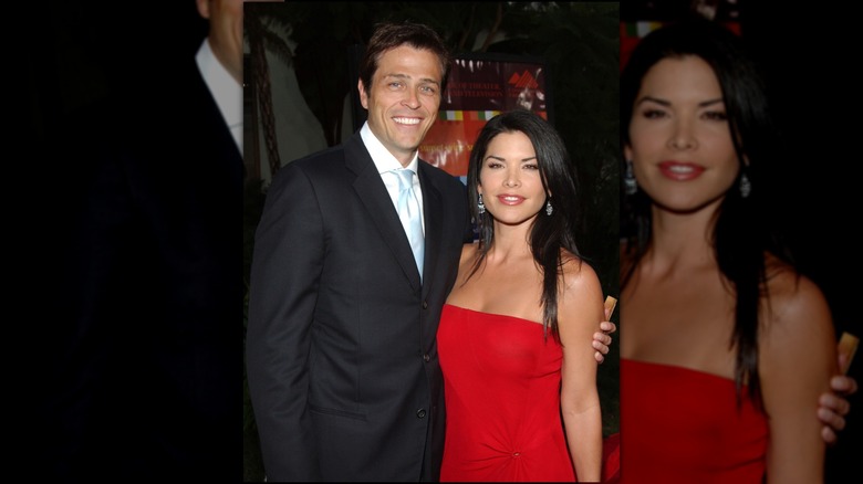Patrick Whitesell has his hand over Lauren Sanchez, who's wearing a red dress.