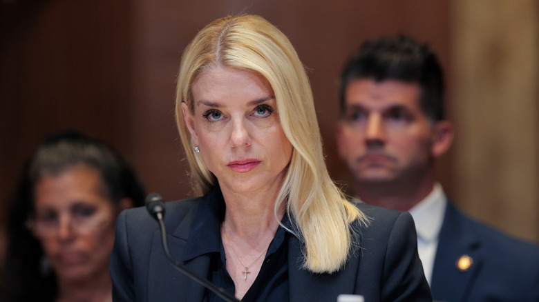 Pam Bondi listening during a hearing