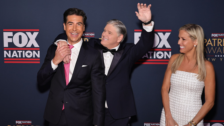 (L-R) Jesse Watters, Sean Hannity and Ainsley Earhardt attend FOX Nation's 2024 Patriot Awards at Tilles Center for the Performing Arts on December 05, 2024 in Greenvale, New York (2024)