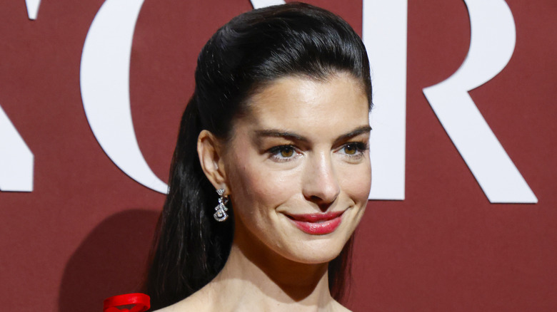 Anne Hathaway photographed at the 2025 WWD Honors