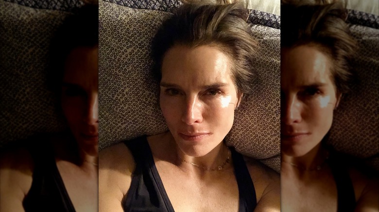 Brooke Shields laying down, taking a selfie.