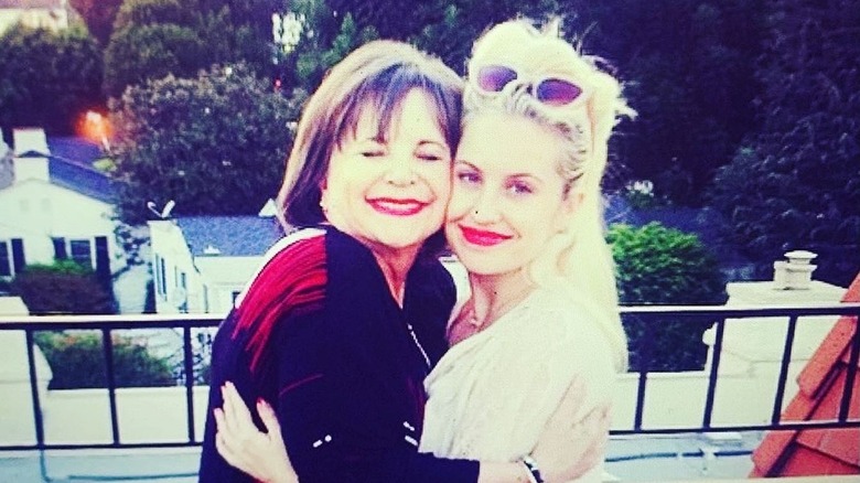 Cindy Williams and Emily Hudson hugging and smiling