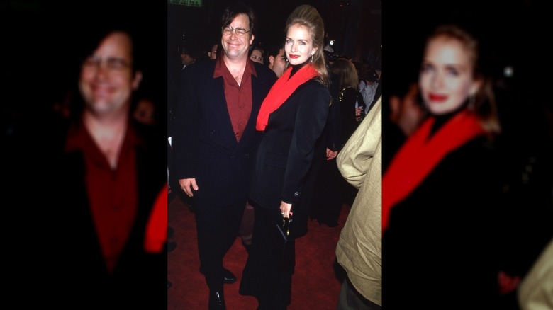 Dan Aykroyd and Donna Dixon walk the red carpet in the 1980s.