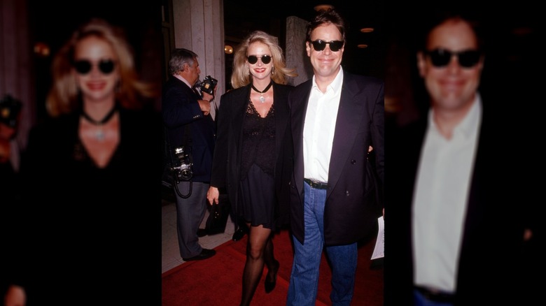 Dan Aykroyd and Donna Dixon walk the red carpet in the 1980s.