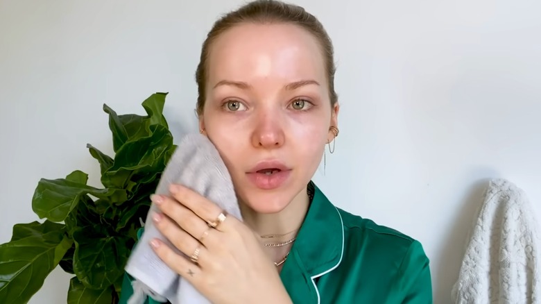 Dove Cameron washing her face
