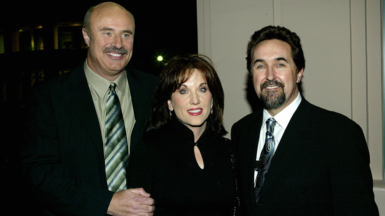 Phil McGraw, Robin McGraw, and Bryce Zabel smiling
