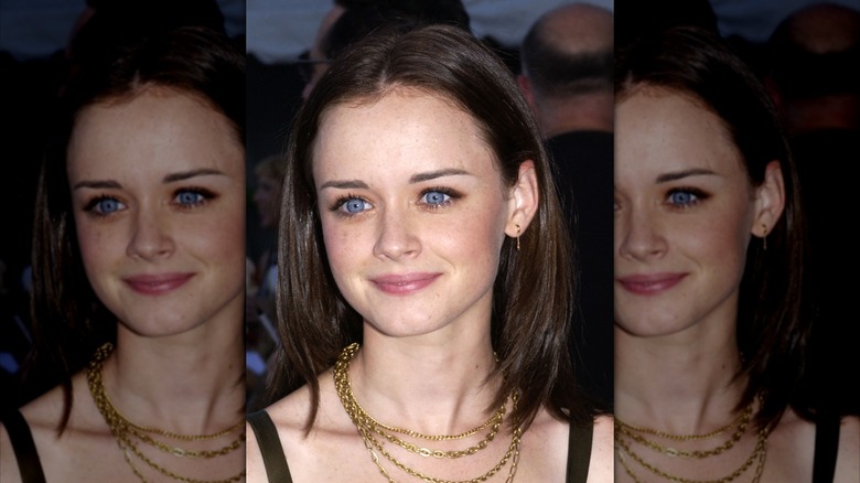 Alexis Bledel smiling with a gold necklace