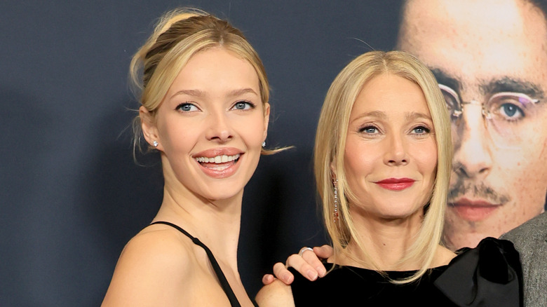 Apple Martin and Gwyneth Paltrow in matching blonde hair and black dresses