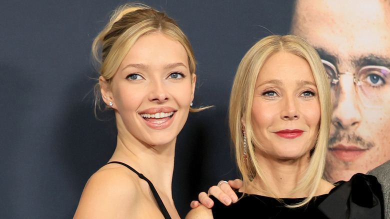 Apple Martin and Gwyneth Paltrow in matching blonde hair and black dresses