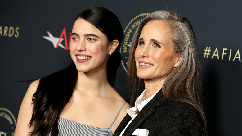 Margaret Qualley and Andie MacDowell flashing matching smiles