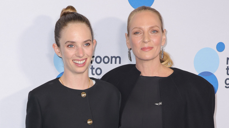 Maya Hawke and Uma Thurman twinning in black formals