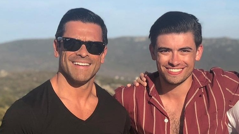 Michael Consuelos and Mark Consuelos posing on holiday together