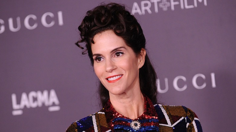 Jami Gertz with her dark hair piled on top of her head