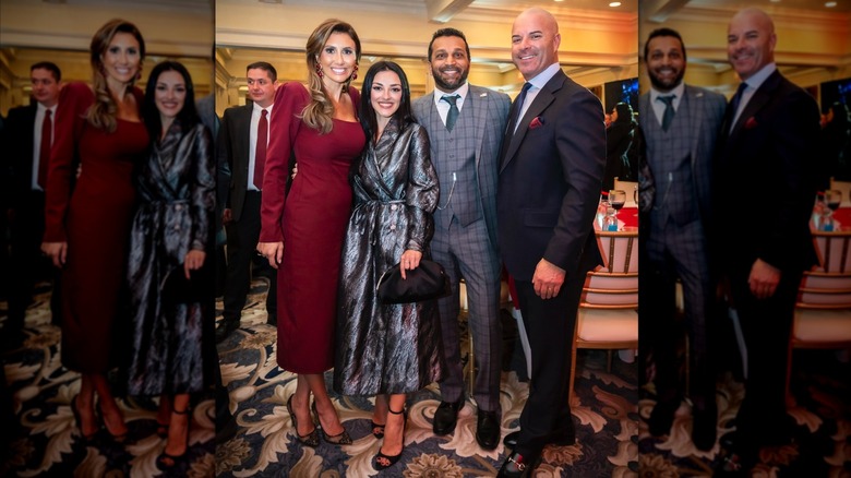 Kash Patel and Alexis Wilkins posing with others