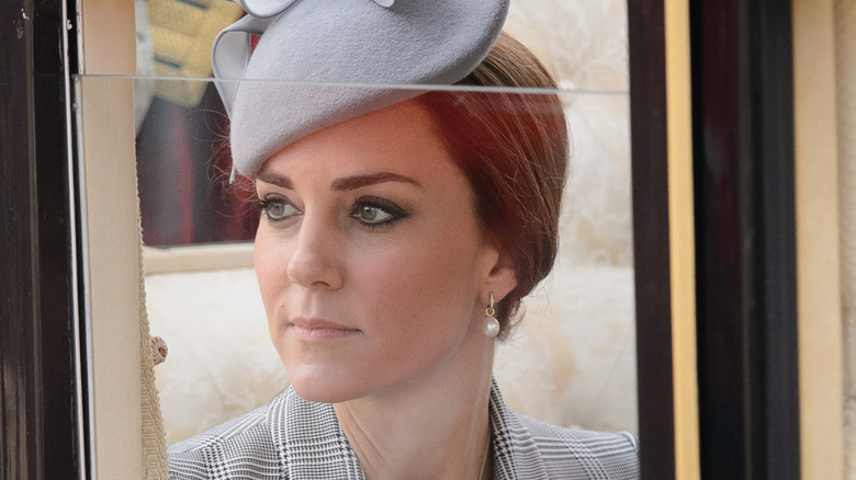 Princess Catherine close-up during 2014 state visit with a blue hat and pearl earrings