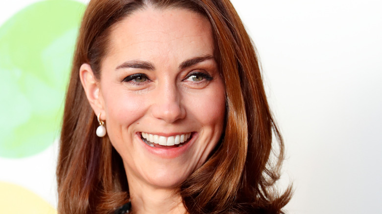 Princess Catherine smiling and looking slightly to the side