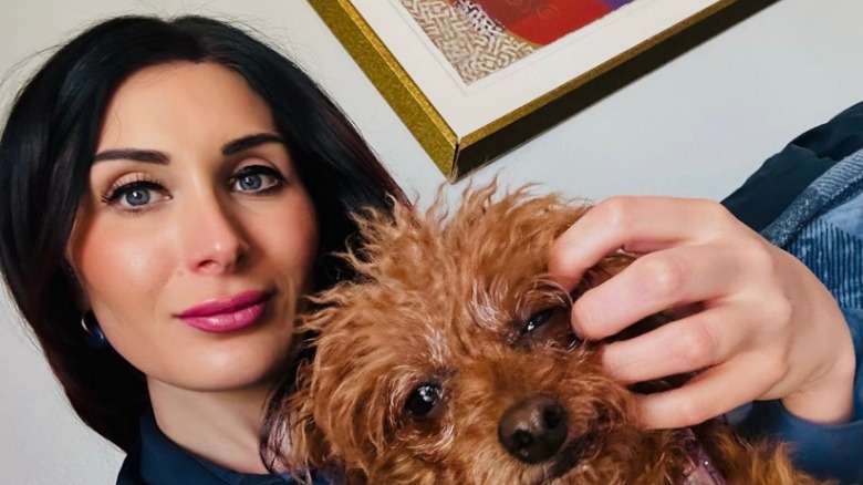 Laura Loomer poses for a selfie with her dog Mecca at home in 2025