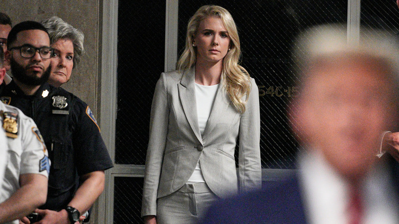 Natalie Harp keeping an eye on Donald Trump from a short distance away