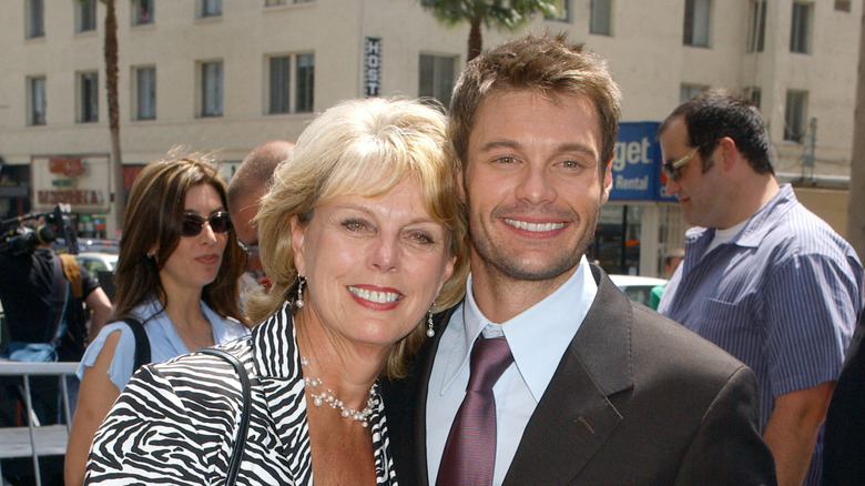 Connie Seacrest in a zebra jacket and Ryan Seacrest in a suit